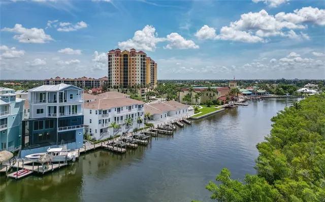 a view of a lake with tall buildings