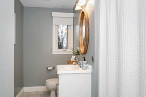 9 Irene Road Framingham, MA 01701 - Photo 33 of 36 a bathroom with a sink a toilet and a mirror