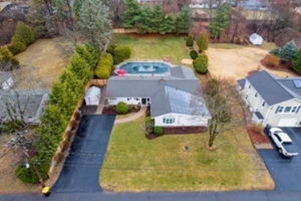9 Irene Road Framingham, MA 01701 - Photo 4 of 36 a view of a swimming pool with an outdoor space and seating area