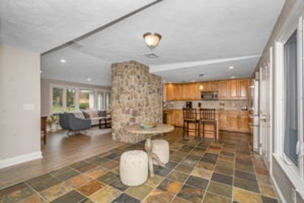 9 Irene Road Framingham, MA 01701 - Photo 7 of 36 a living room with couches and kitchen view with wooden floor