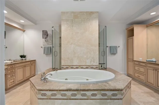 a bathroom with a granite countertop sink mirror bathtub and shower