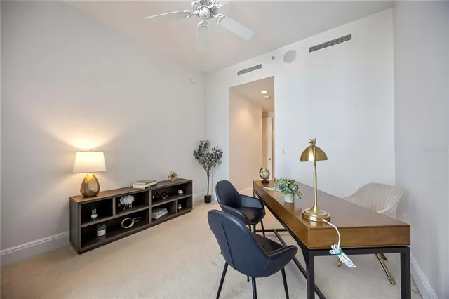 a bathroom with a shower sink vanity mirror and toilet