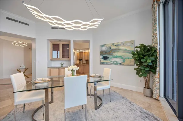 a dining room with furniture and window