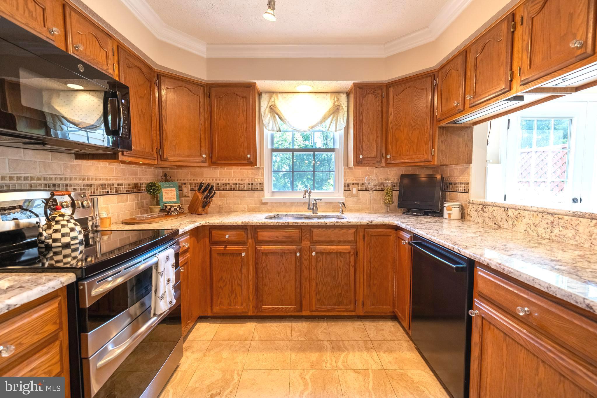14084 Winding Ridge Lane Centreville, VA 20121 - Photo 23 of 48 Lots of cabinets and designer backsplash