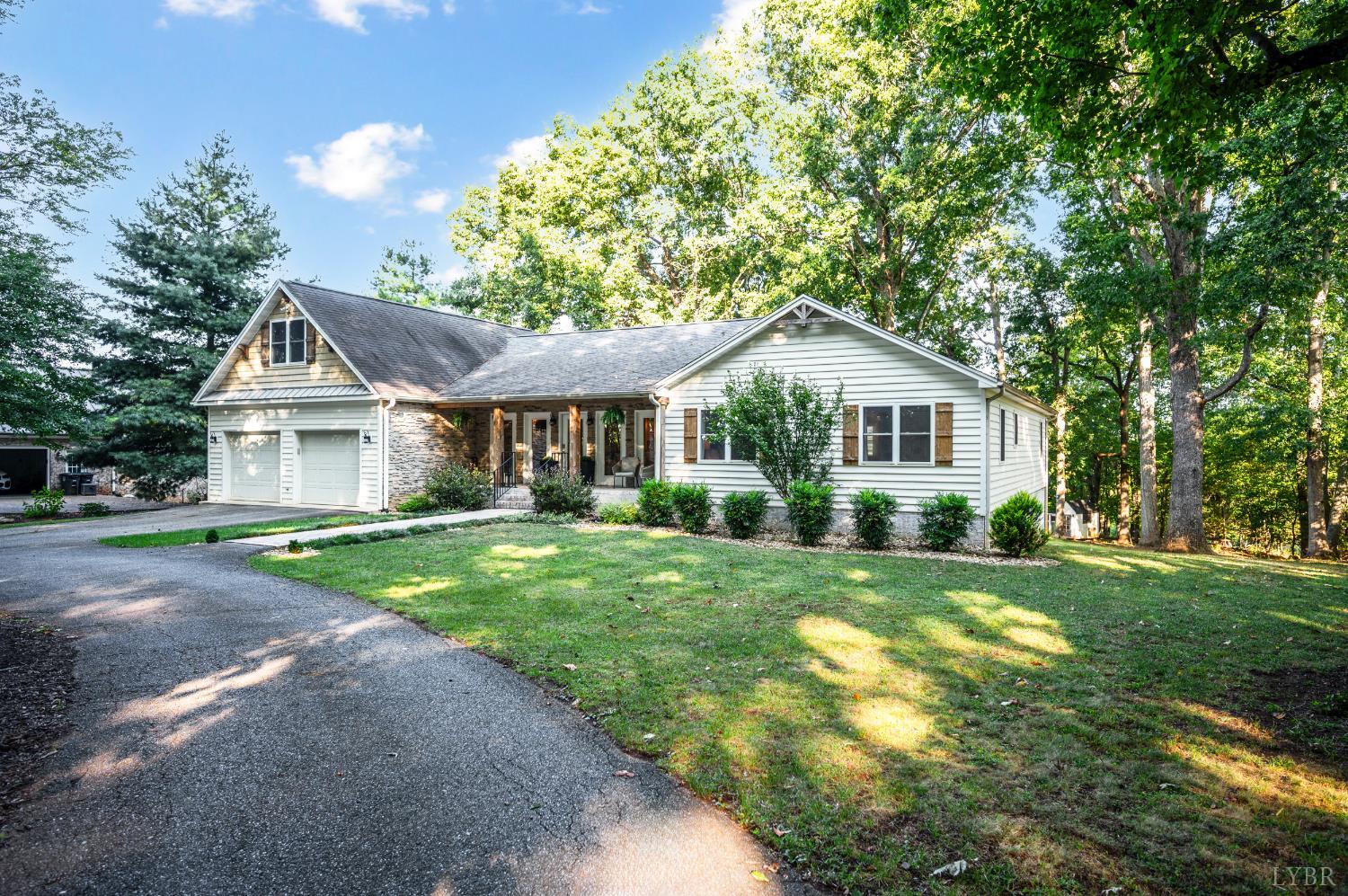 1203 Everett Road Forest, VA 24551 - Photo 2 of 68 a view of a house with a yard and sitting area