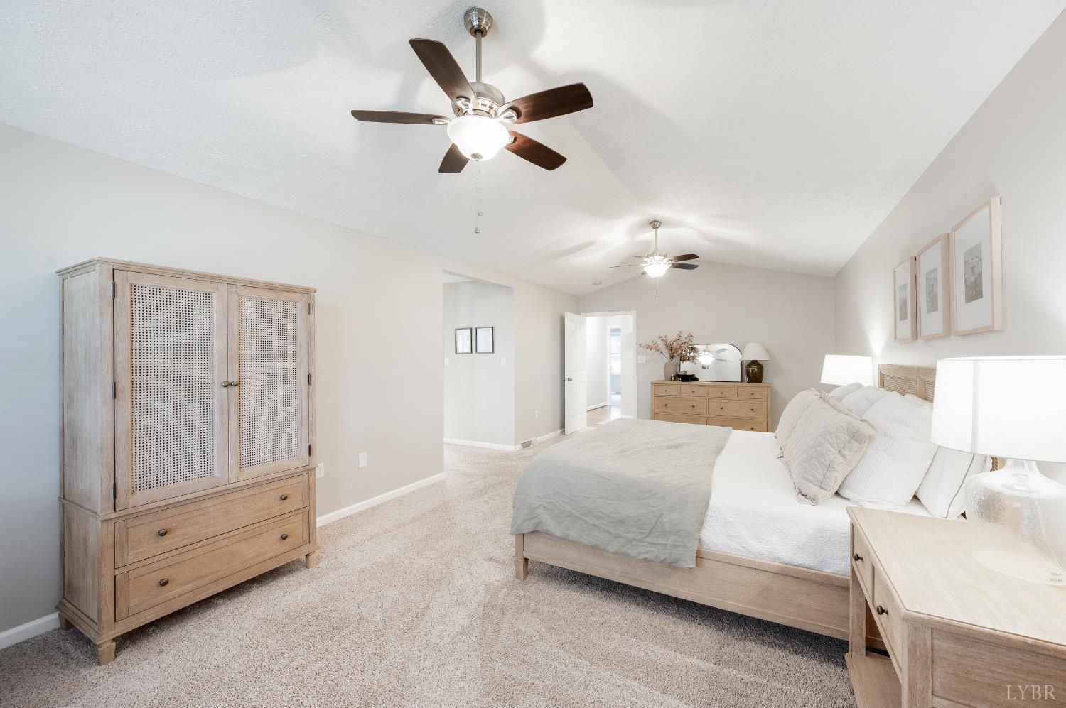 1203 Everett Road Forest, VA 24551 - Photo 23 of 68 a bedroom with a large bed and ceiling fan
