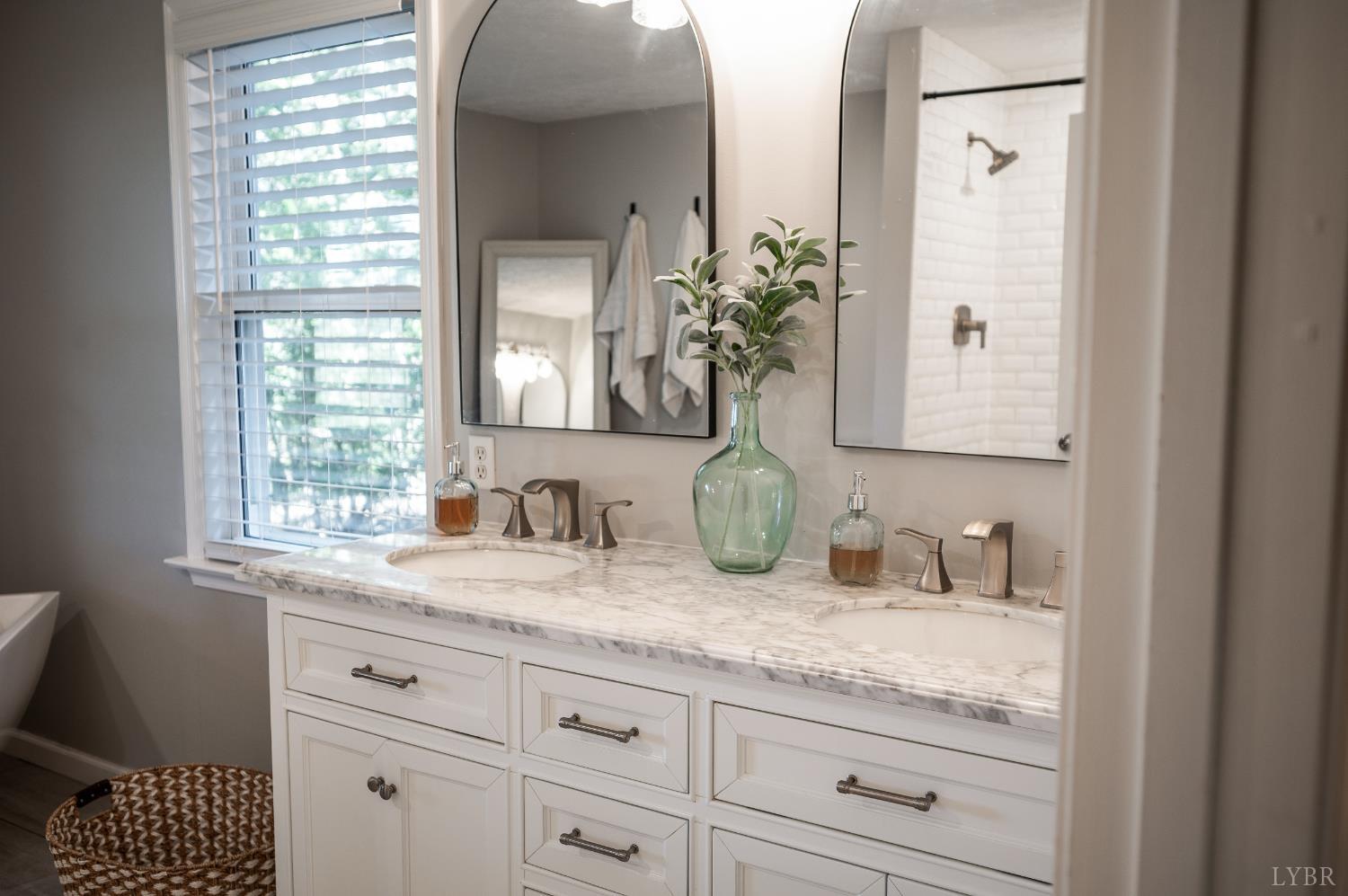 1203 Everett Road Forest, VA 24551 - Photo 24 of 68 a bathroom with a granite countertop sink and a mirror