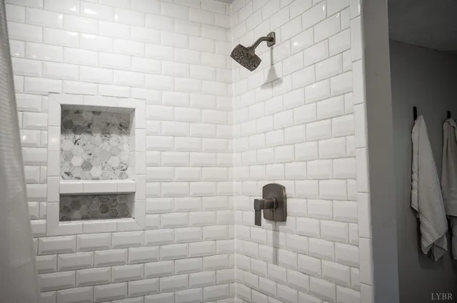 a spacious bathroom with a bathtub and a toilet