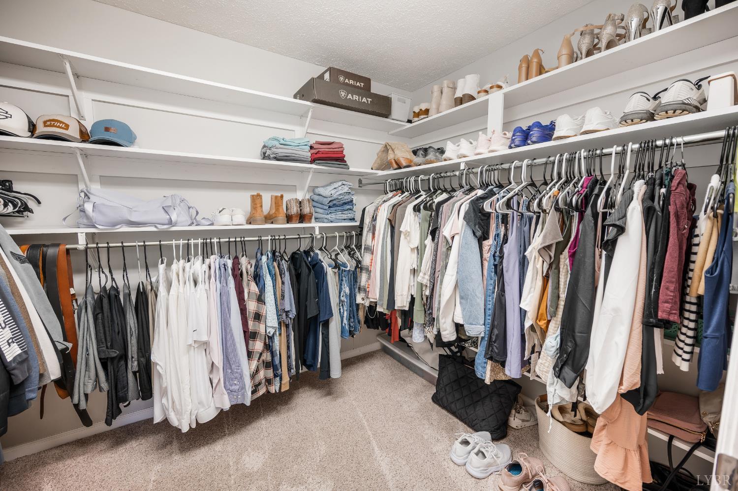 1203 Everett Road Forest, VA 24551 - Photo 27 of 68 a view of walk in closet with clothes and shoes