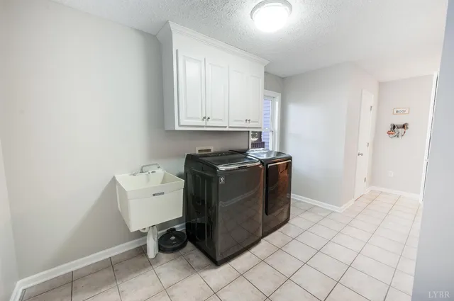 a view of a house with a yard chairs and table