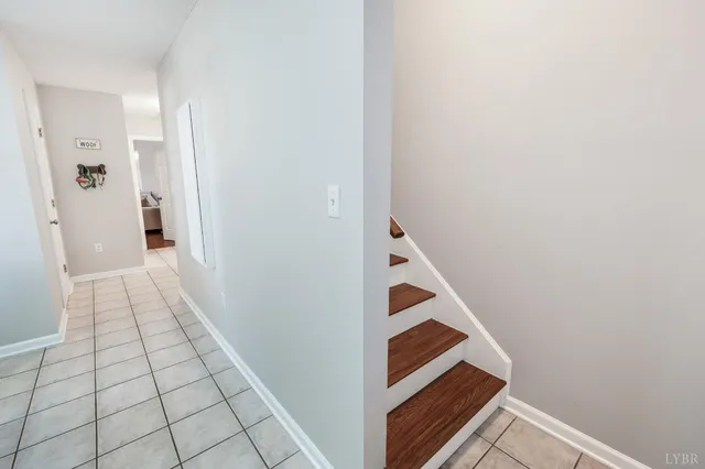 a view of a livingroom with a hardwood floor and a ceiling fan