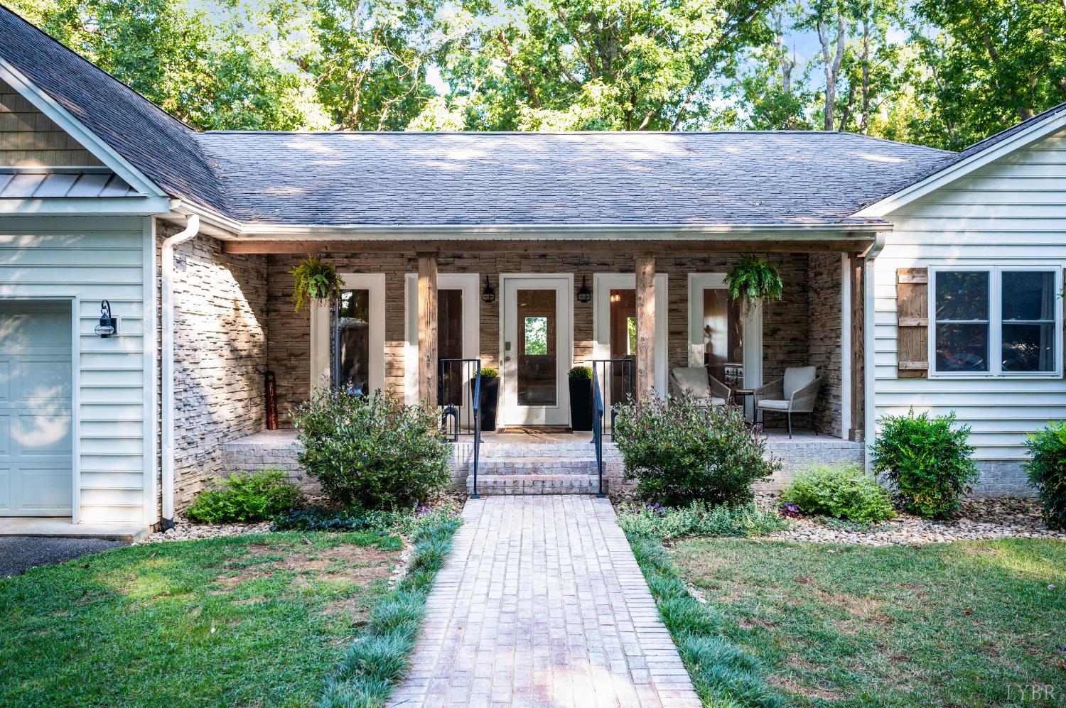 1203 Everett Road Forest, VA 24551 - Photo 5 of 68 a front view of a house with garden