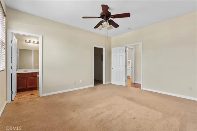 a view of an empty room with a bathroom
