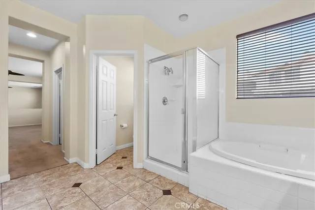 a view of a bathroom with a tub shower and sink
