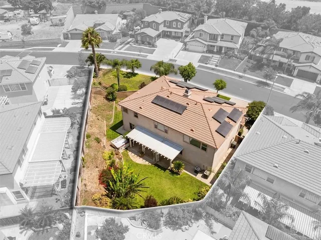 an aerial view of a house with a swimming pool