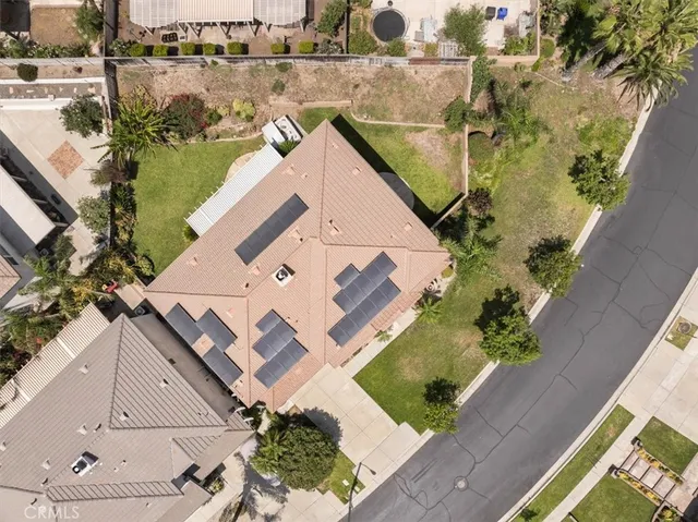 an aerial view of a house with outdoor space and lake view