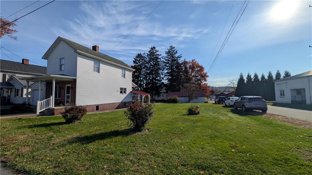 180 Liberty Street Perryopolis, PA 15473 - Photo 2 of 21 a view of a house with backyard and sitting area