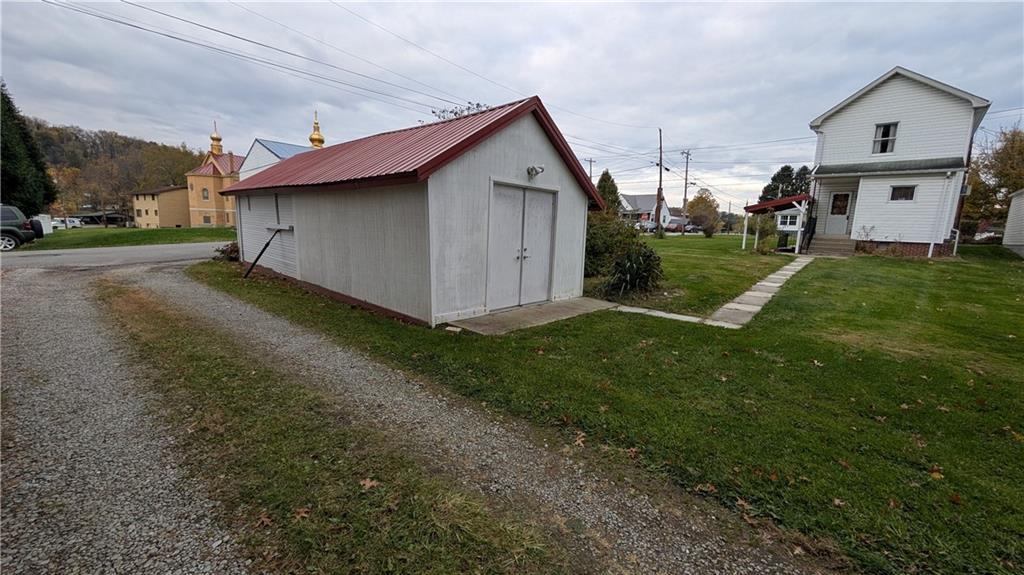 180 Liberty Street Perryopolis, PA 15473 - Photo 7 of 21 a view of a back yard of the house