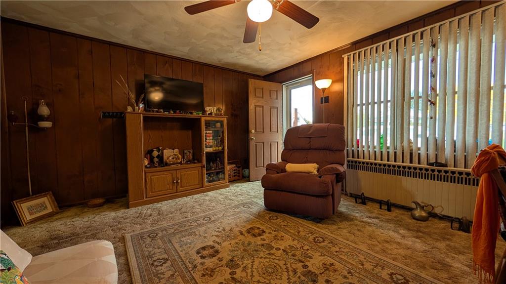 180 Liberty Street Perryopolis, PA 15473 - Photo 10 of 21 a living room with furniture and a flat screen tv