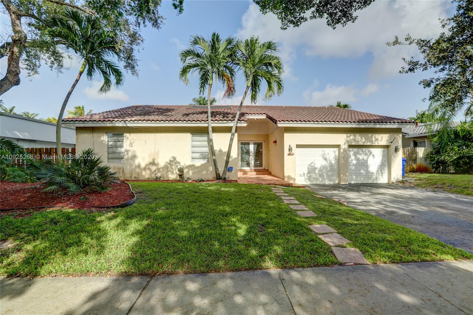3501 North Park Road Hollywood, FL 33021 - Photo 1 of 30 a front view of a house with garden