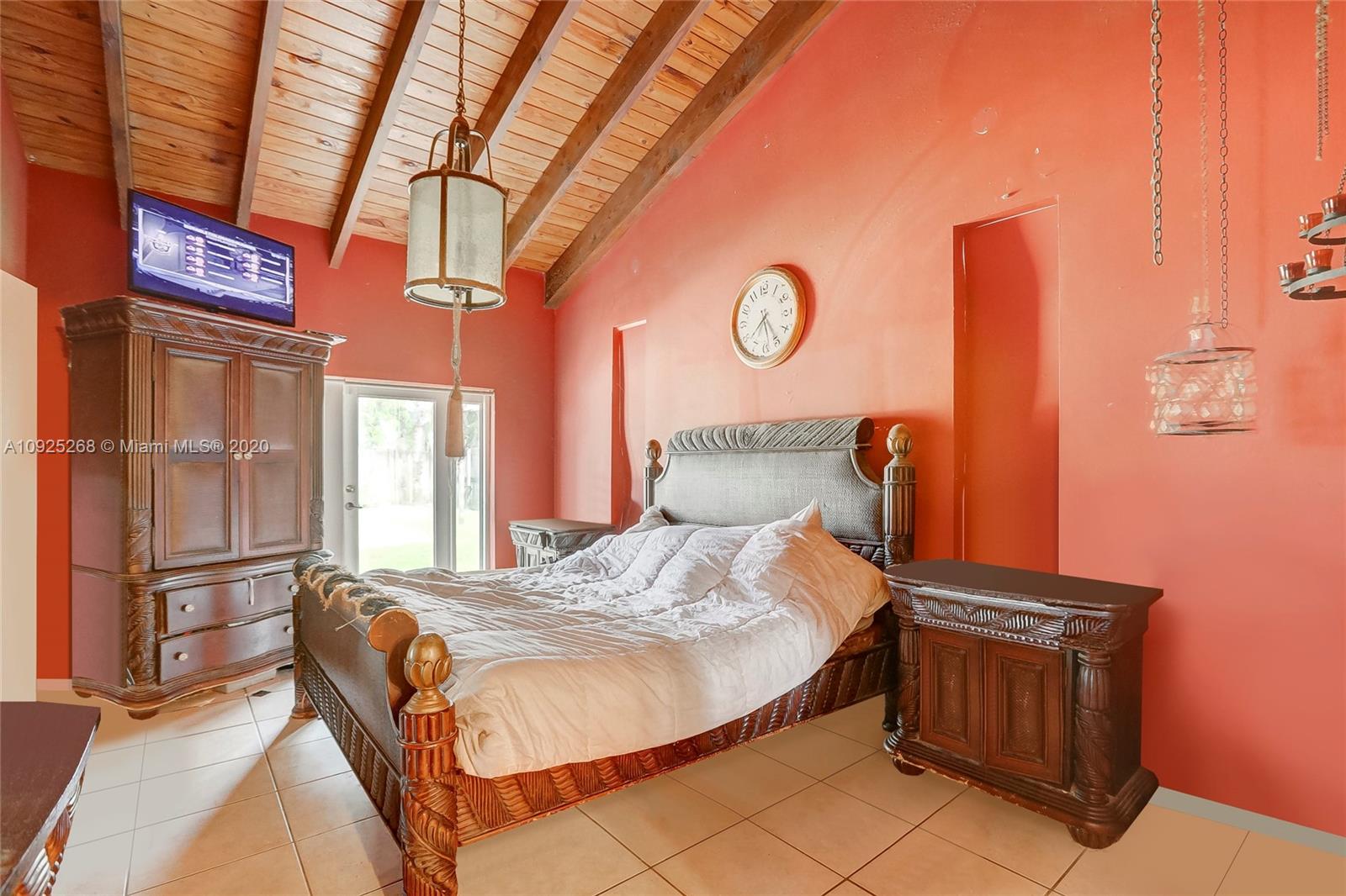 3501 North Park Road Hollywood, FL 33021 - Photo 12 of 30 a bed sitting in a bedroom next to a window