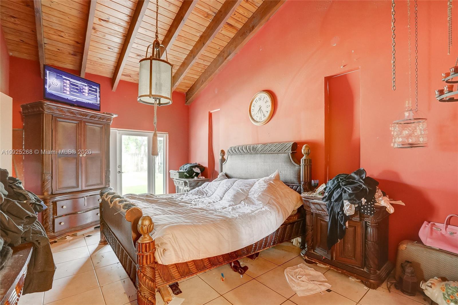 3501 North Park Road Hollywood, FL 33021 - Photo 13 of 30 a bed sitting in a bedroom next to a window