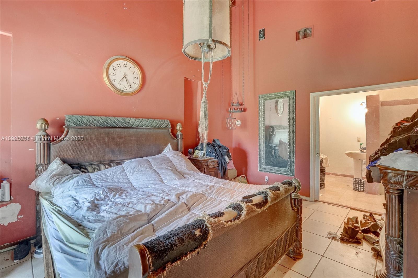 3501 North Park Road Hollywood, FL 33021 - Photo 14 of 30 a bed sitting in a bedroom next to a window