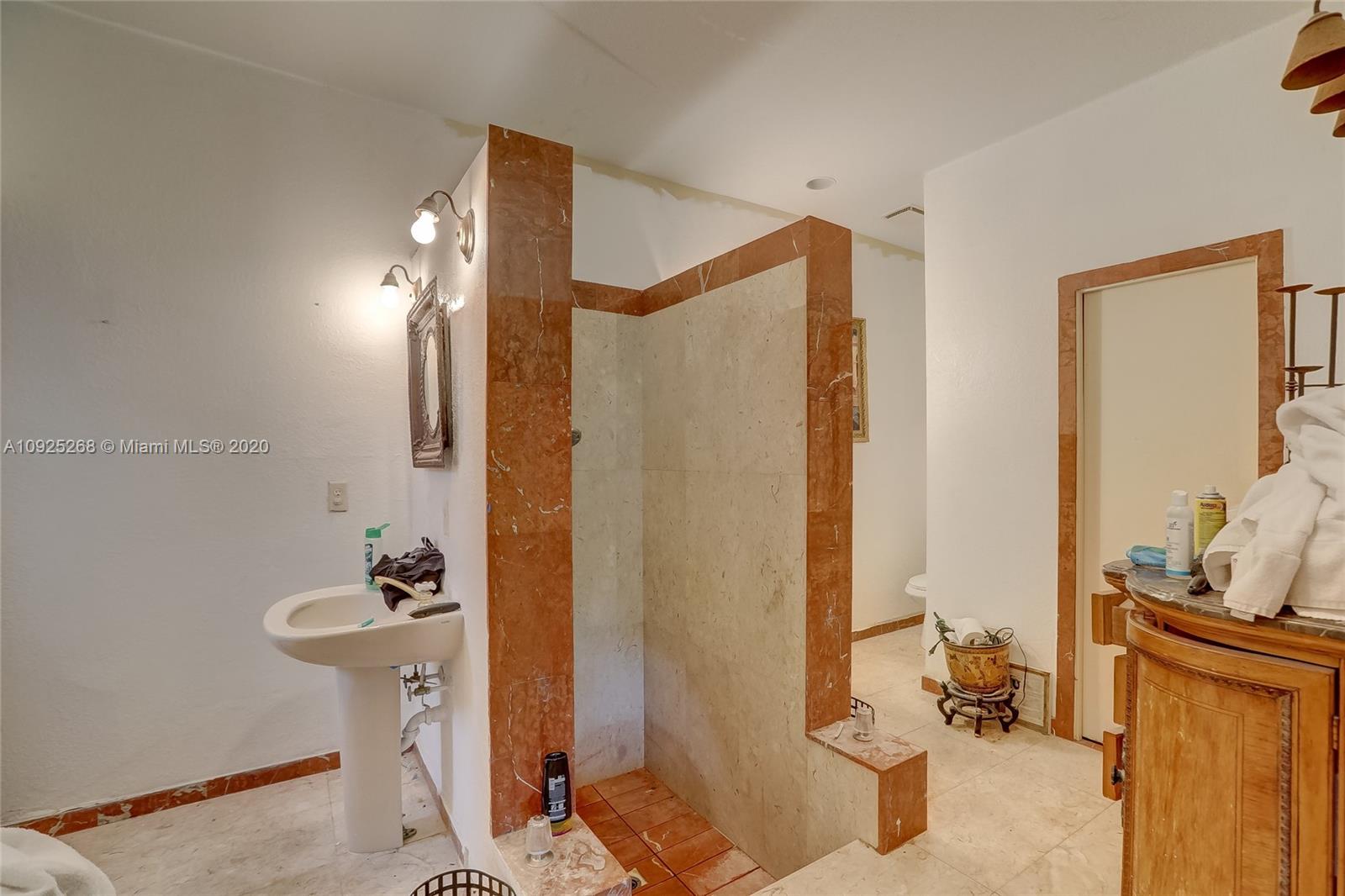 3501 North Park Road Hollywood, FL 33021 - Photo 15 of 30 a bathroom with a sink and a mirror