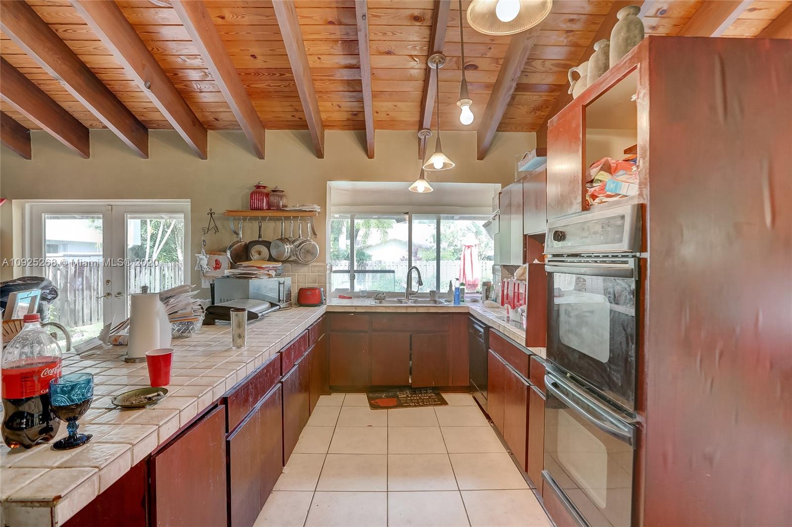 3501 North Park Road Hollywood, FL 33021 - Photo 19 of 30 a kitchen with kitchen island granite countertop lots of counter top space