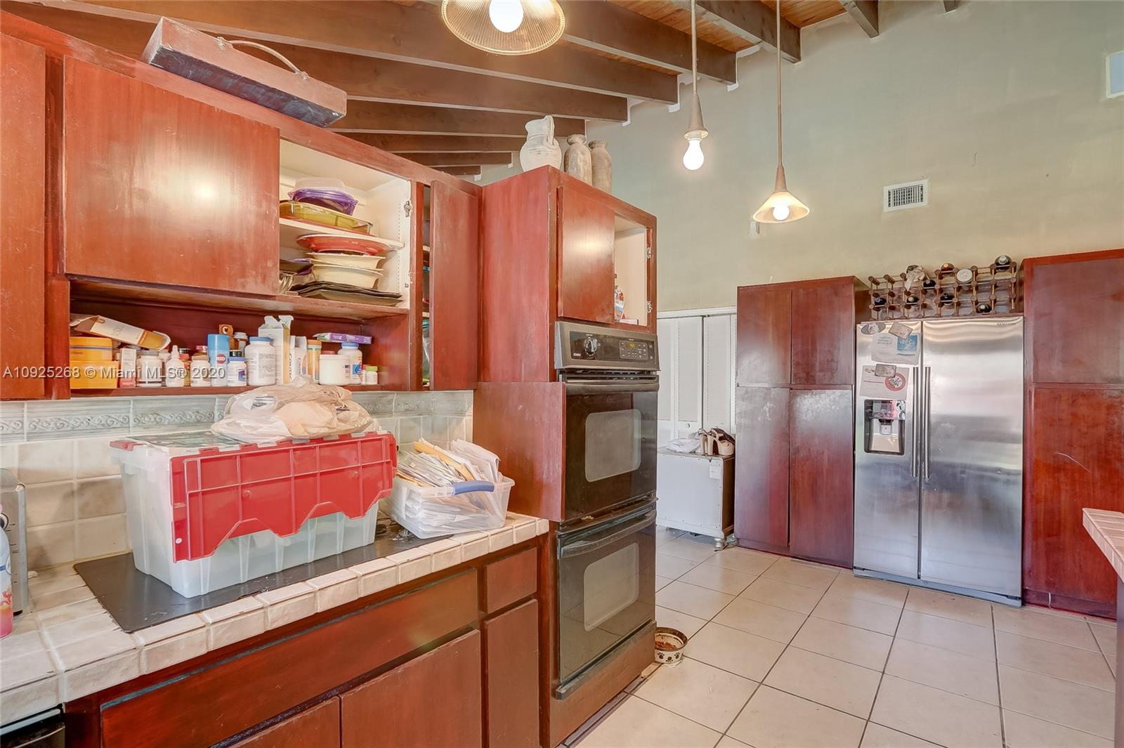 3501 North Park Road Hollywood, FL 33021 - Photo 22 of 30 a kitchen with refrigerator and cabinets