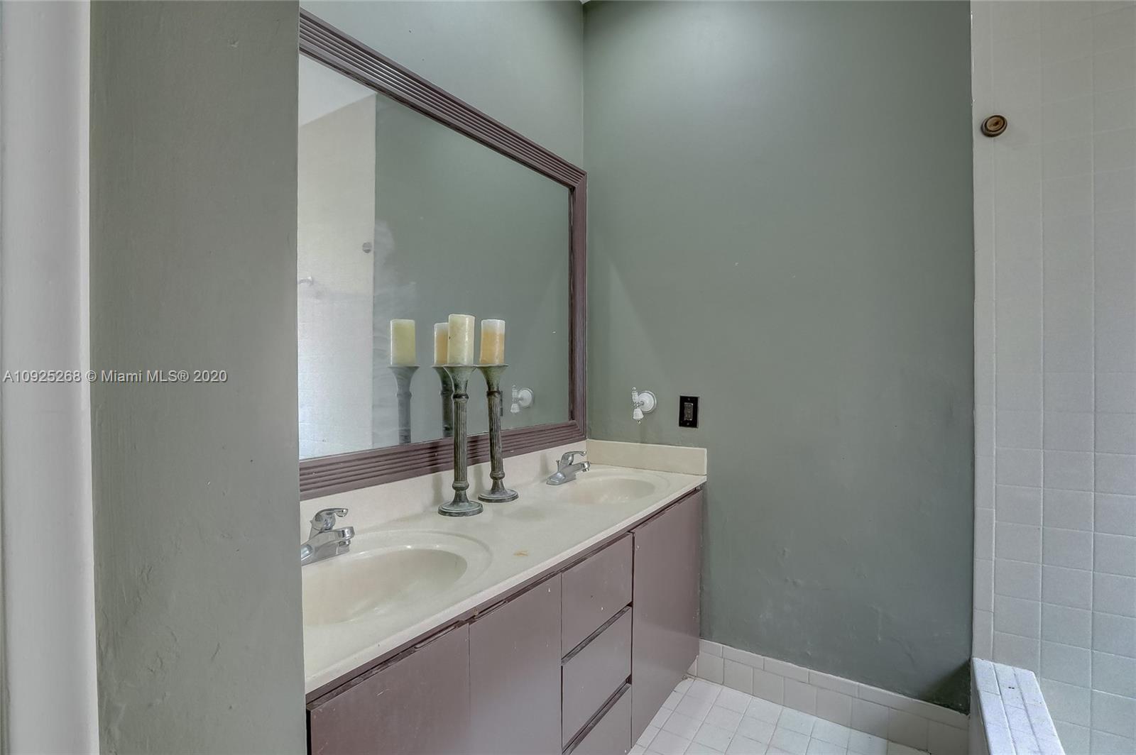 3501 North Park Road Hollywood, FL 33021 - Photo 24 of 30 a bathroom with a sink and a mirror