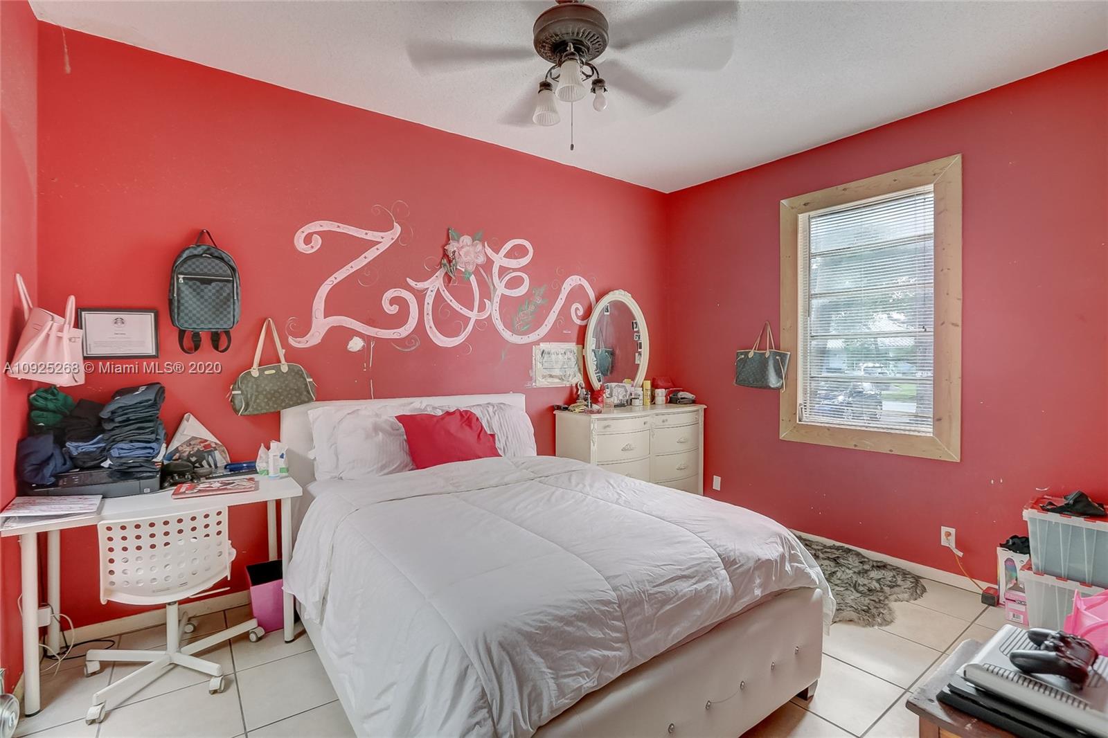 3501 North Park Road Hollywood, FL 33021 - Photo 26 of 30 a bedroom with a bed and a chandelier