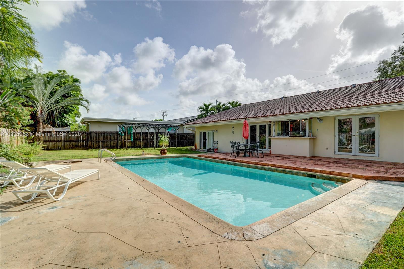 3501 North Park Road Hollywood, FL 33021 - Photo 29 of 30 a view of a house with swimming pool and a yard