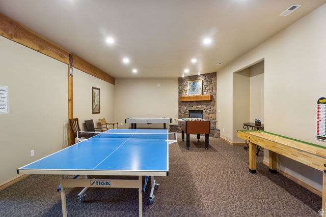 3598 North Huntsman Path, Unit 502 Eden, UT 84310 - Photo 25 of 43 Playroom with a stone fireplace and recessed lighting