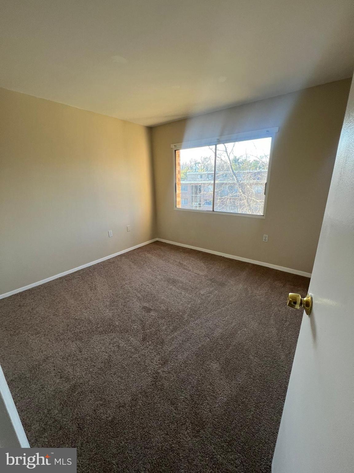 3732 Bel Pre Road, Unit 9 Silver Spring, MD 20906 - Photo 17 of 21 an empty room with windows