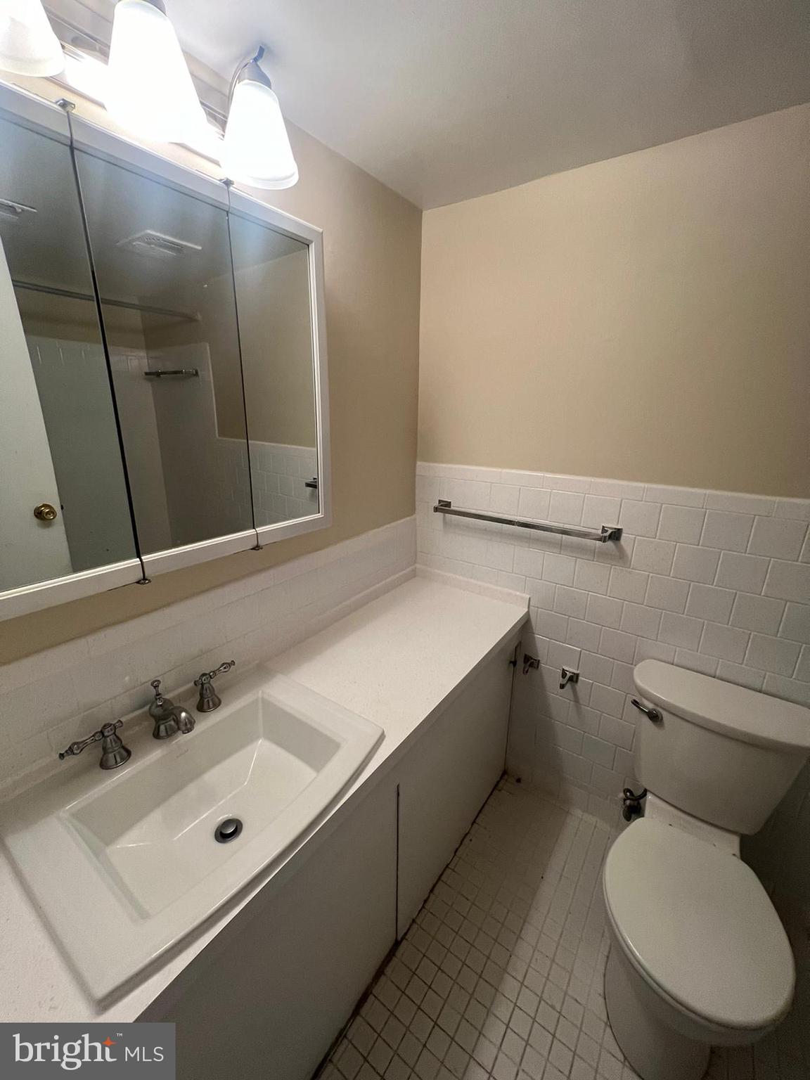 3732 Bel Pre Road, Unit 9 Silver Spring, MD 20906 - Photo 3 of 21 a bathroom with a sink mirror vanity and toilet