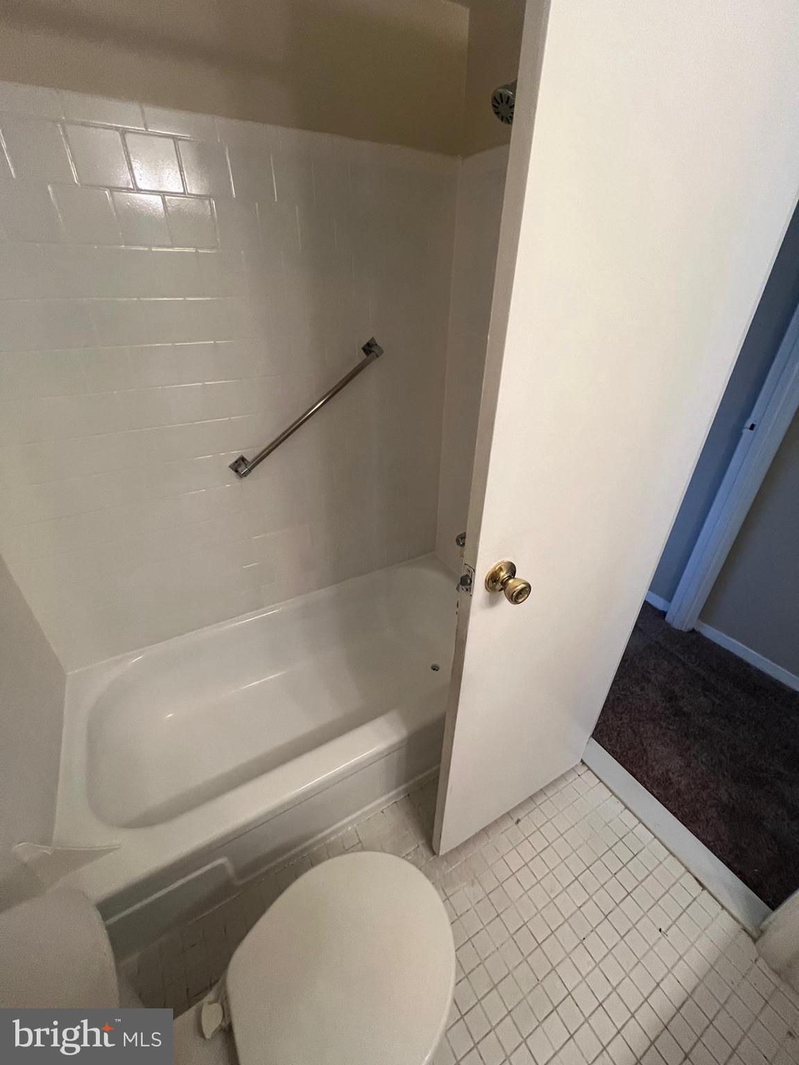 3732 Bel Pre Road, Unit 9 Silver Spring, MD 20906 - Photo 4 of 21 a bathroom with a toilet and a bathtub