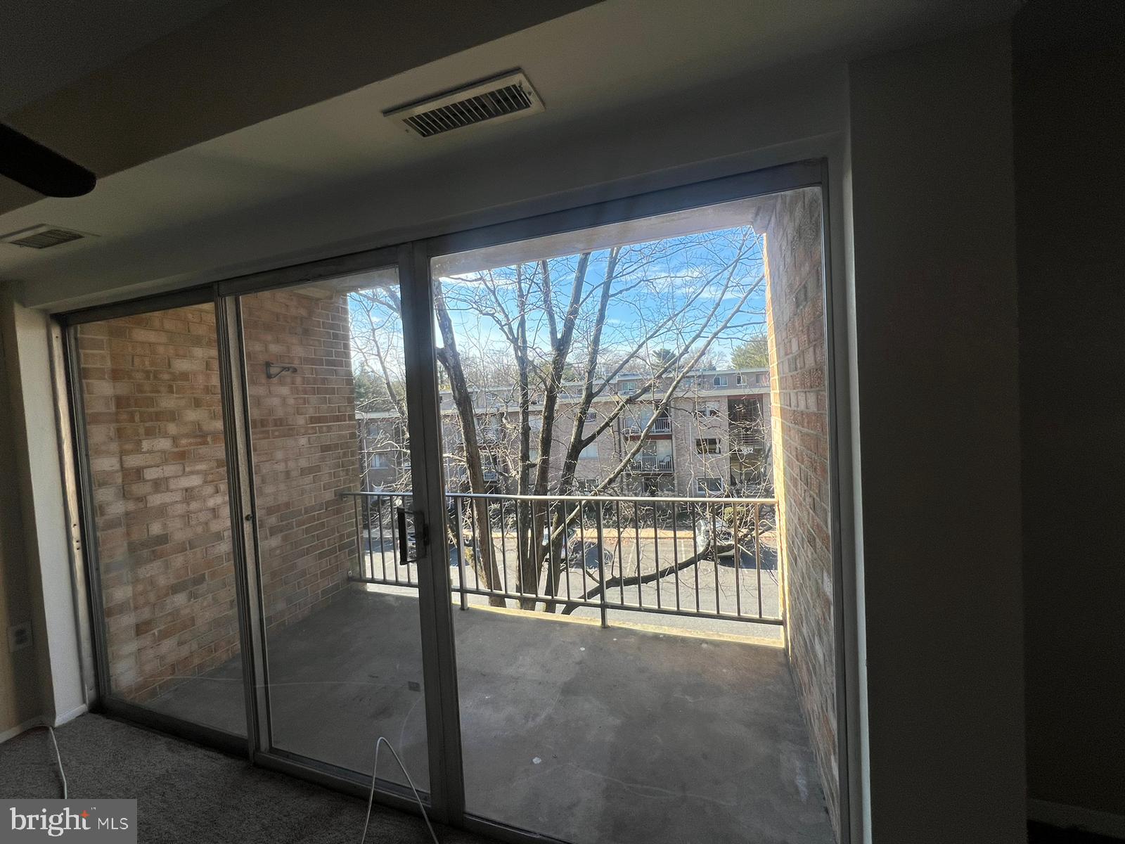 3732 Bel Pre Road, Unit 9 Silver Spring, MD 20906 - Photo 9 of 21 a view of a glass door and the balcony