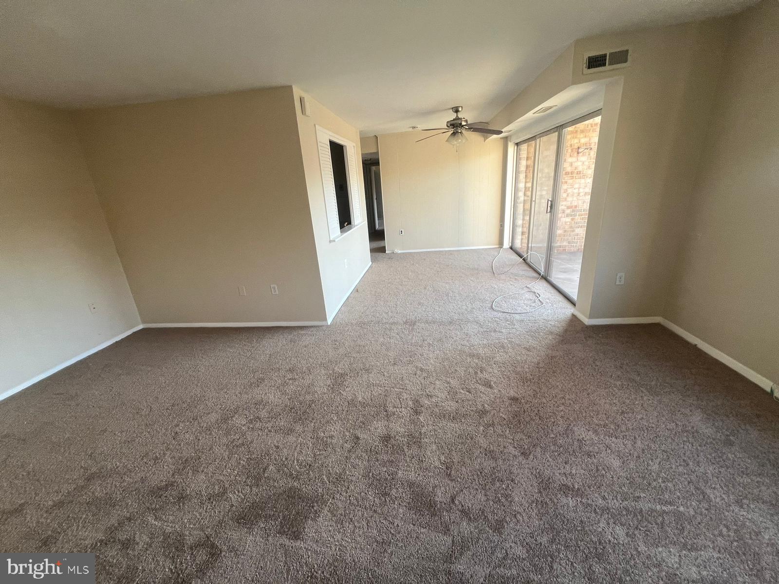 3732 Bel Pre Road, Unit 9 Silver Spring, MD 20906 - Photo 10 of 21 an empty room with windows and closet