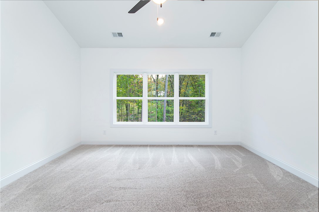 328 Point Road Westminster, SC 29693 - Photo 16 of 37 This spacious room features a large window offering expansive views of nature.