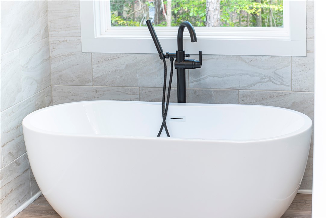 328 Point Road Westminster, SC 29693 - Photo 19 of 37 Relax in this tranquil soaking tub, perfectly placed by a large window overlooking lush greenery.