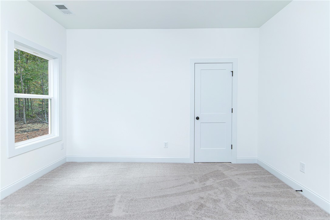 328 Point Road Westminster, SC 29693 - Photo 25 of 37 This spacious room features ample natural light and a clean, inviting atmosphere.