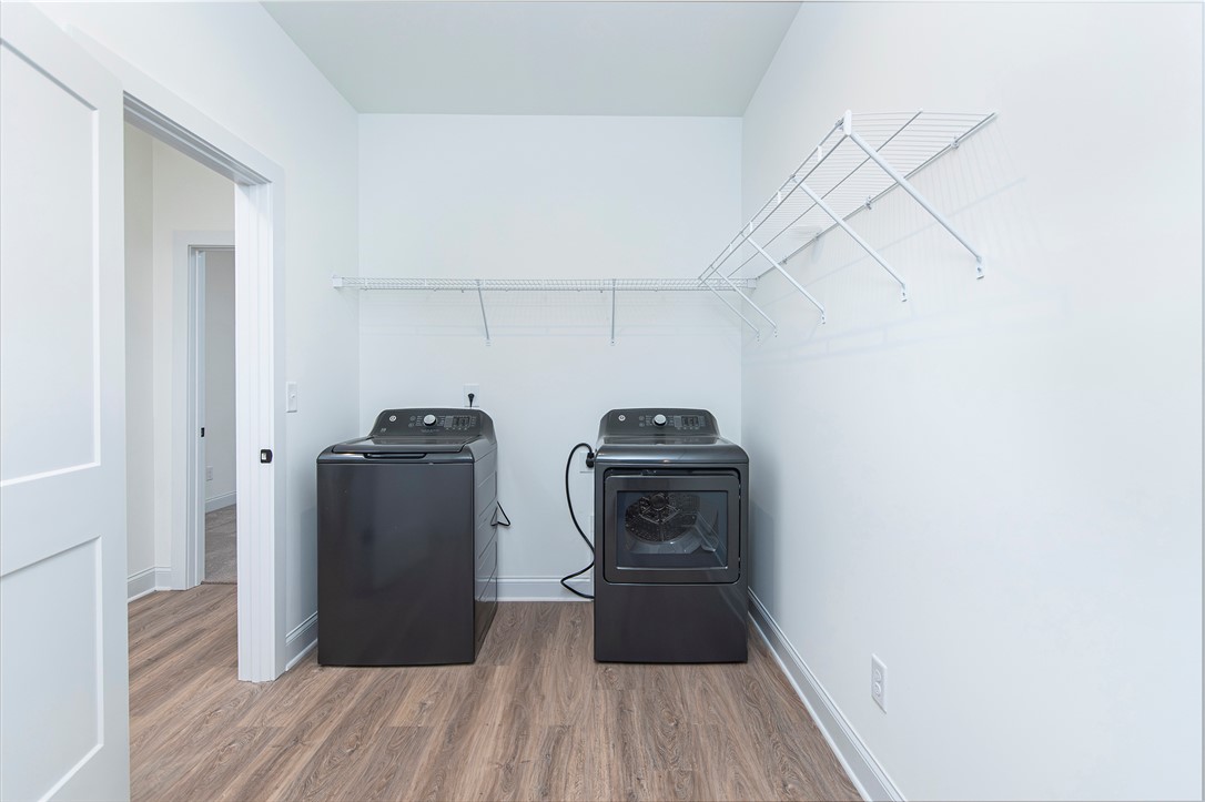 328 Point Road Westminster, SC 29693 - Photo 29 of 37 This dedicated space includes a washer, dryer, and convenient shelving for all your laundry needs.