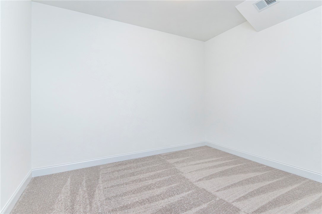 328 Point Road Westminster, SC 29693 - Photo 32 of 37 This versatile space features clean walls and plush carpet, ready for personalization.