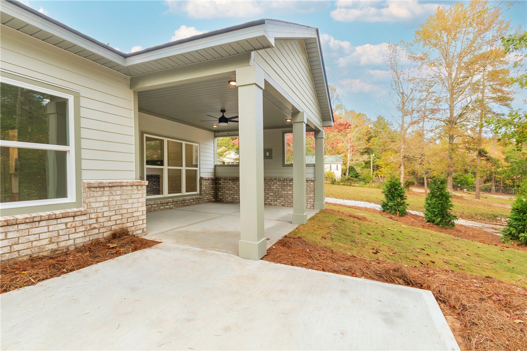 328 Point Road Westminster, SC 29693 - Photo 36 of 37 This inviting patio extends living spaces outdoors, offering a tranquil retreat with ample room for entertaining.