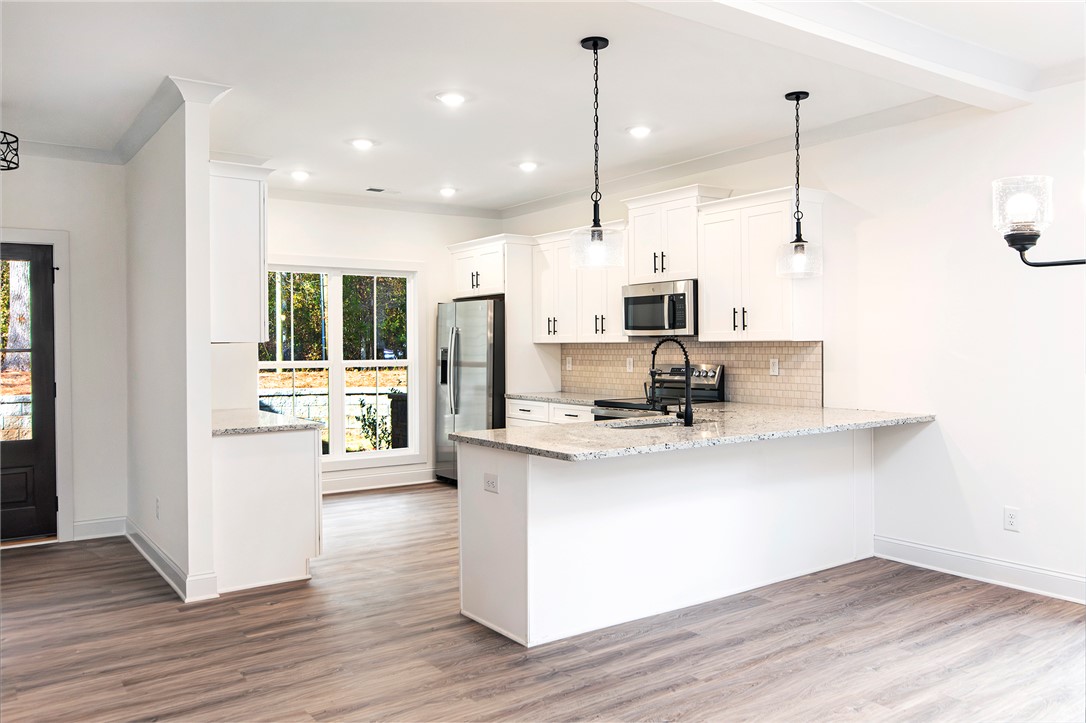 328 Point Road Westminster, SC 29693 - Photo 7 of 37 This bright kitchen features modern appliances and ample counter space, perfect for everyday living.
