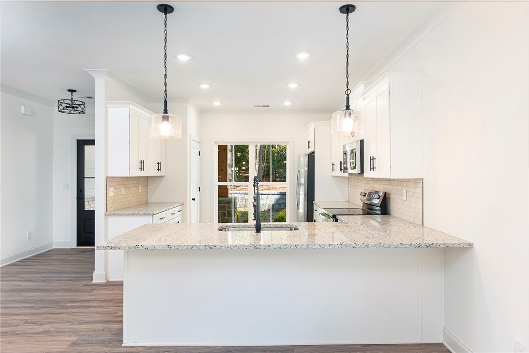 328 Point Road Westminster, SC 29693 - Photo 8 of 37 This bright kitchen features sleek appliances and ample counter space, perfect for everyday living.