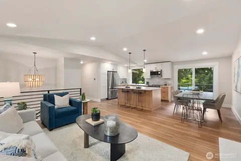 a living room with furniture and kitchen view