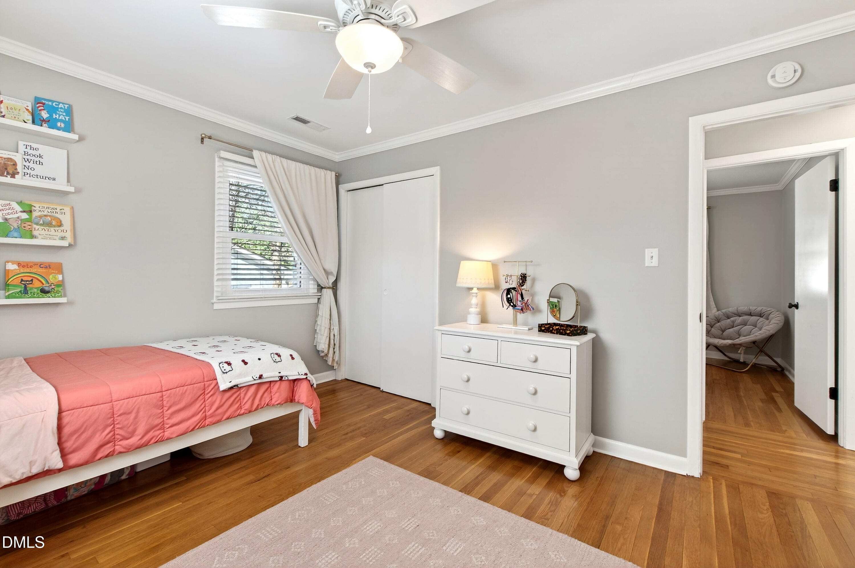 308 Latimer Road Raleigh, NC 27609 - Photo 22 of 50 a bedroom with a bed and a chandelier