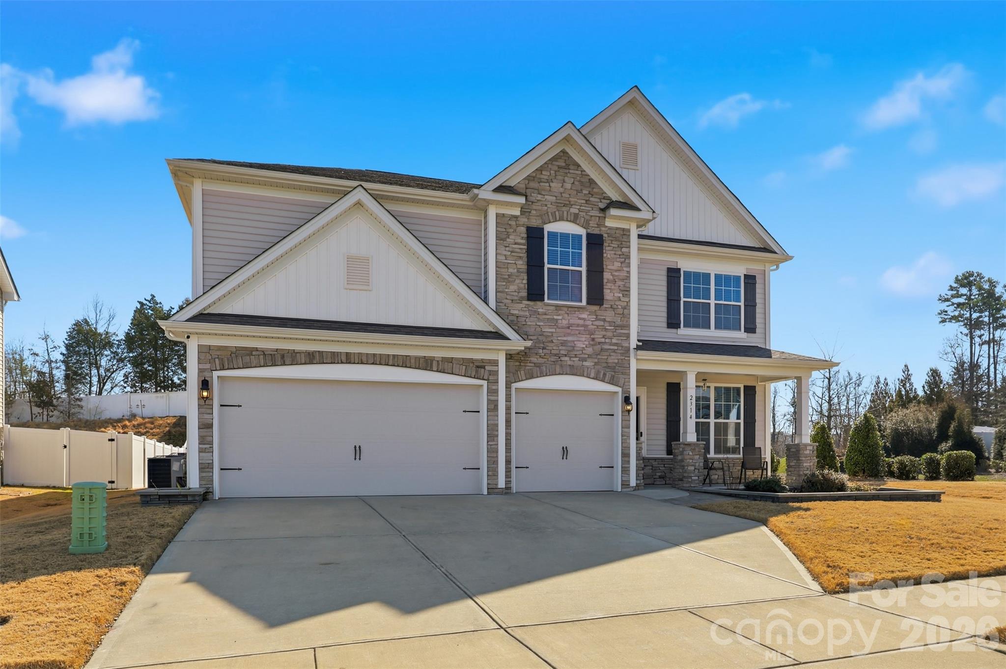 2314 Red Birch Way Concord, NC 28027 - Photo 1 of 44 a front view of a house with a yard and garage